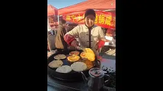 Cooking deep fried pies with chive filling, Chinese street food.