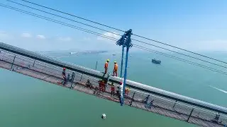 Main cable strands on Lingdingyang Bridge completed in S China