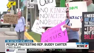 People protesting Rep. Buddy Carter