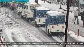 Heavy traffic jams on roads due to snowfall, several vehicles got stuck & skid on road. Watch video