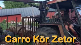 Lastar grova ekstockar med zetor 7045 / Girl loading heavy logs with hydraulic crane.