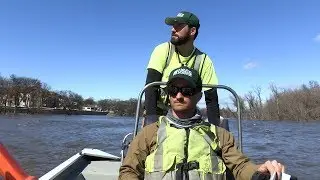 USGS survey crew collects flow rate data on the Red River