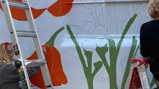 California Wildflowers mural being painted by amillionair at Umbrella Alley