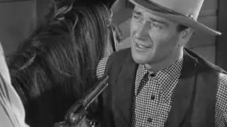 John Wayne Calls Ella Raines' Bluff in Tall In The Saddle