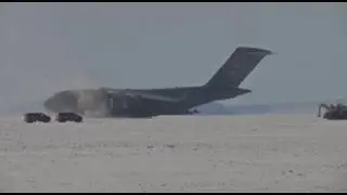 C-17 Globemaster III take off from deep snow runway at Phoenix Airfield, Antarctica