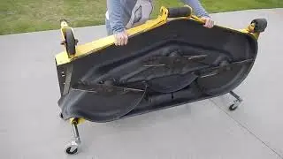 DeckAxles.com -- Mower deck storing stands. Swiveling wheels deck dolly.