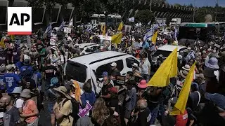 Protesters block a highway in Jerusalem demanding the release of hostages
