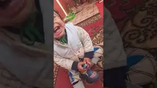 Cute boy laughing at musical instruments