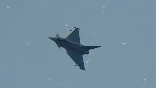 Military fighter jet climbing in clear sky