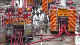 Bodies carried away after deadly Hong Kong fire claims 128 lives and sparks safety crackdown