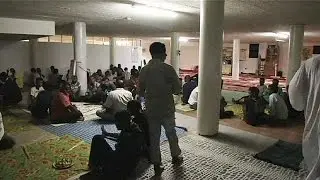 Migrants and refugees celebrate Muslim holiday in an abandoned building in Rome