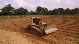 D6R HIGH TRACK DOZER PULLING A 1940 RIPPER