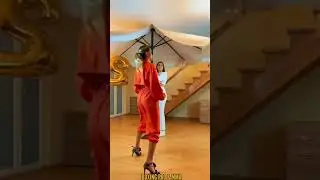 Black belt kicking balloons on high heels!