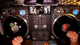 Hardcore vinyl scratching to drum and bass beat