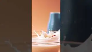 #shorts  of a strawberry falling into milk, in slowmotion