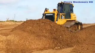 Skill Operator SHANTUI Bulldozer Working Spreading Sand To Slop Water Filling Up