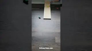 Colorful Wooden Cylinders Roll Down the Plank