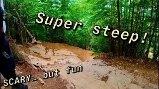 Conquering 2 scary rock rolls at Highland Mountain Bike Park!