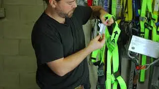 How to inspect a safety harness and put it on.