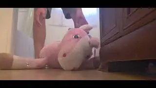 trampling on a jumbo unicorn plush again