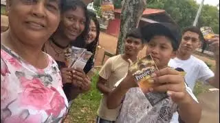 Brazil Frontline Missions Mama Rosa and youths sharing Bible tracks on the road and supermarkets.