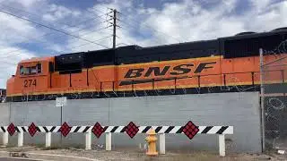 BNSF 1686 moves forward including SD75M 274 and stops for a switch at the yard