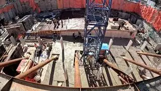 Time-lapse of one day's  construction, underground parking garage slab on grade.