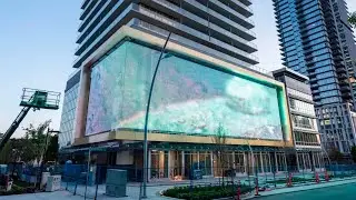 Outdoor LED Mesh Display Transforms Building into North America&rsquo;s Largest Digital Art Canvas