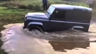 Land Rover defender in deep water