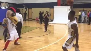 Norris Cole dances with Pelicans mascot Pierre