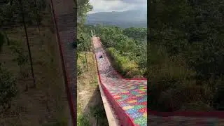 My mom going a huge colorful slide #shorts #shortvideos #adventures  #elsalvador #elsalvadortravel