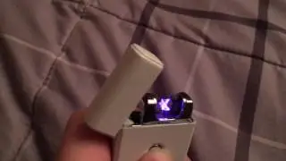 Spparx purple Plasma Arc USB lighter demo (blowing on the arcs)