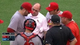 STL@CHC: Lynn gets visit from trainers, stays in game