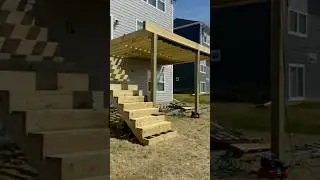 Installing stairs + EPDM drainage to keep it dry under the deck!#DeckBuild #EPDM #MNContractor