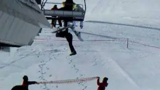 Skier hanging from ski lift