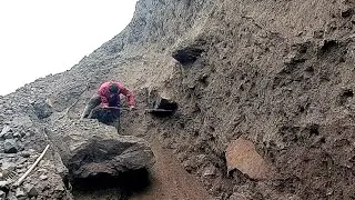 The Fall of the Rock Hanging on the Sand Cliff Makes it Unstable 