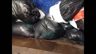 Popping Bags in Compactor (Slowmo) (4K)