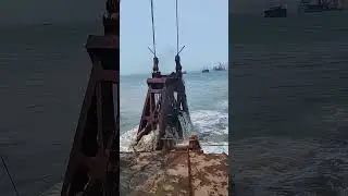 grab dredger in action