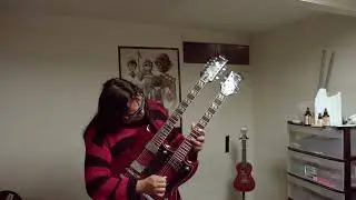 Nirvana, about a girl cover using a double neck sg electric guitar. Played by Red Horse dude.