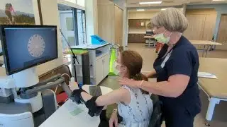 Kietyn Frost trys the BIONIK Labs InMotion ARM at the Rehabilitation Hospital of Montana.