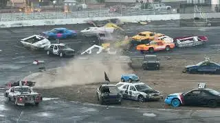 Boats being dragged behind race cars (no trailers) on paved asphalt track. Slides, spins & crashes!