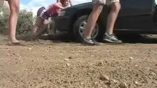 girls push the car