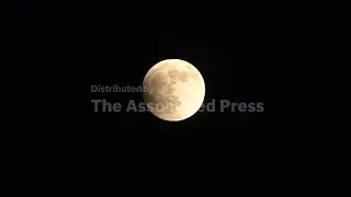 Full blood moon and lunar eclipse over middle eastern sky