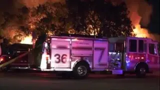 Massive fire burns warehouse, cars in South Houston