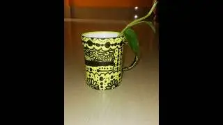 A Beautiful Design On Yellow Colour Cup
