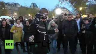 A muslim man hugs in public paris