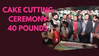 A 40-pound cake was cut by the Ali Azzadar Group to celebrate the birth of Ali.