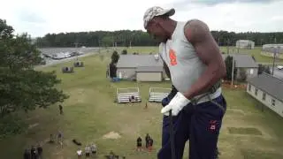 Syracuse football players rappel off a 40 foot tower at Fort Drum