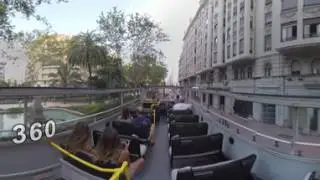 360 VR Double-decker bus with tourists driving in the streets of Valencia, Spain