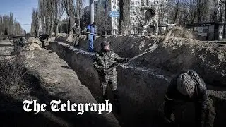 Ukrainians dig trenches around Kyiv as Russian convoy edges closer